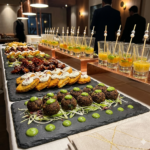 Elegant catering appetizer spread with gourmet starters and soup shots at a corporate event